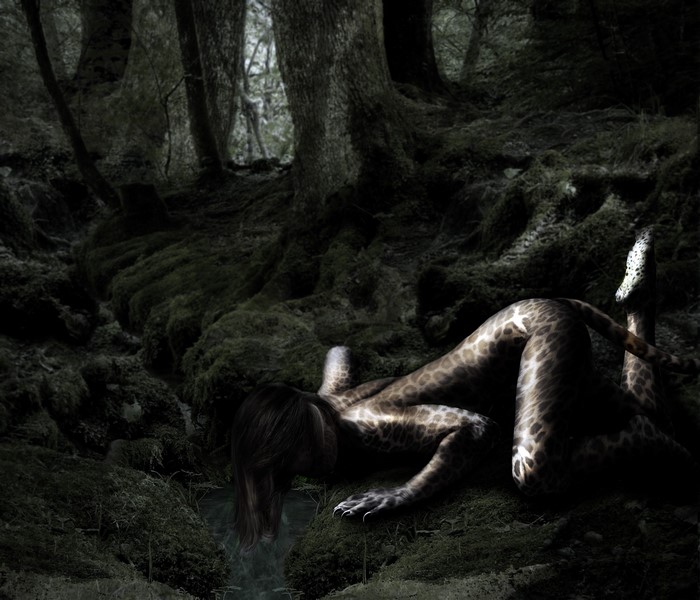 Woman with giraffe pattern in a dark forest