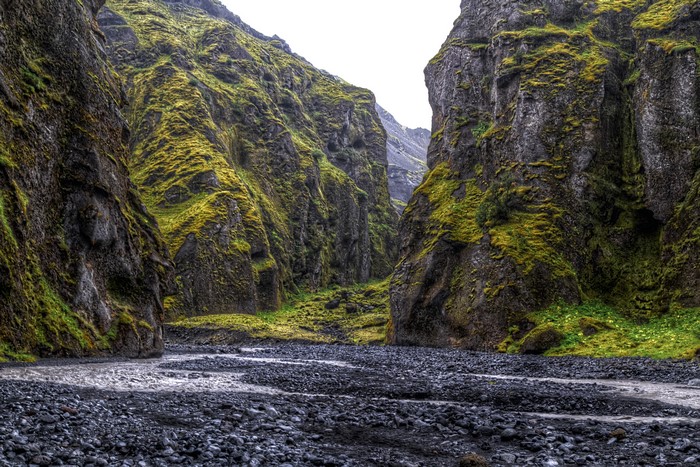 Moss-covered cliffs and riverbed in Thorsmork National Park, Iceland
