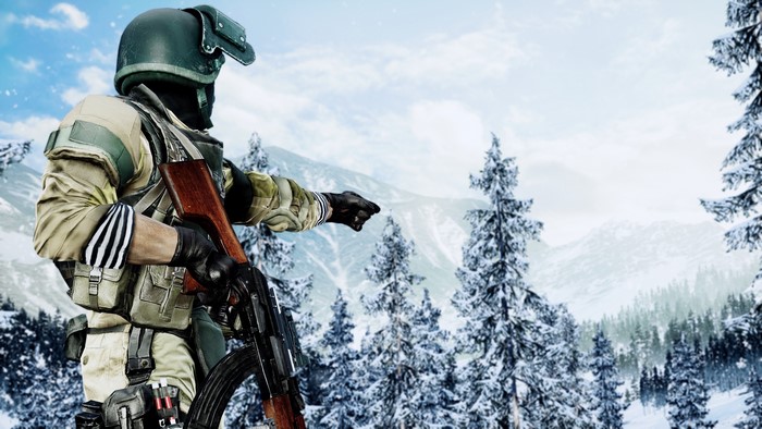 Soldier with AK-47 in snowy mountains