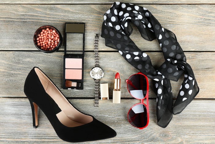 Women's accessories: high heels, makeup, watch, scarf, sunglasses