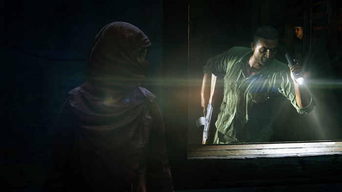 Man with flashlight and gun in Uncharted: The Lost Legacy