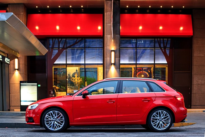 Red Audi A3 Sportback 35 TFSI parked outside building