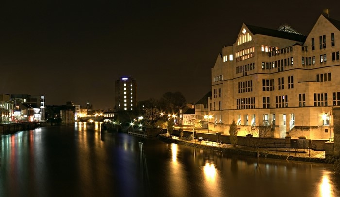 Riverfront buildings at night in York, England