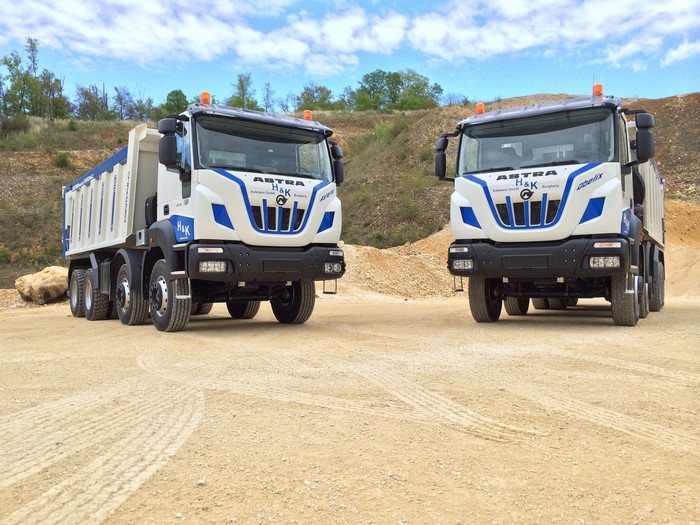 Two ASTRA H&K dump trucks in a quarry
