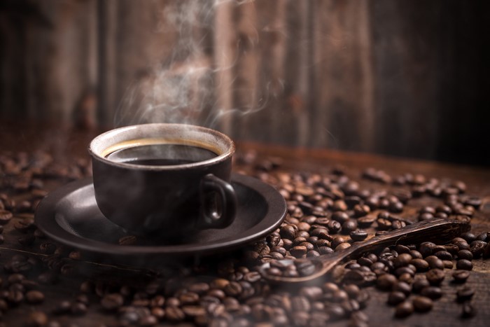 Hot Coffee Cup with Steam and Beans