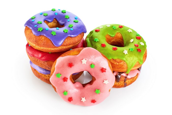 Stack of colorful donuts with star sprinkles