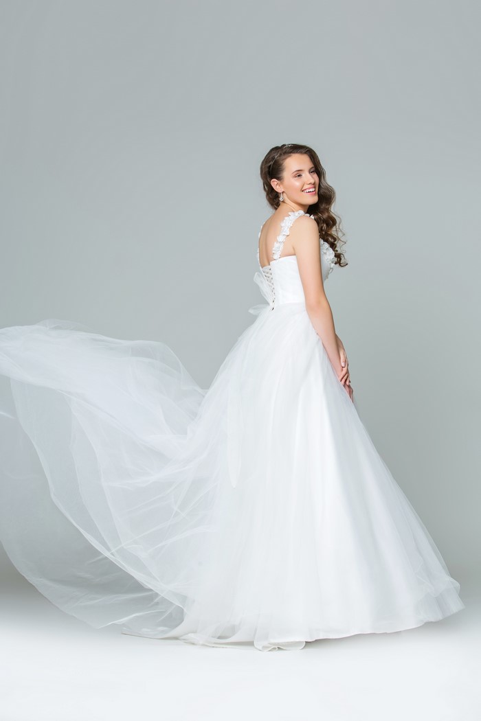 Bride in a white dress with a flowing train