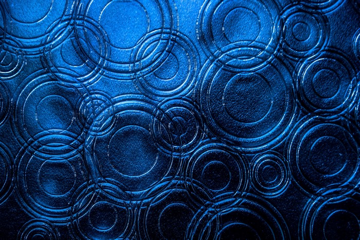 Blue textured surface with concentric circles pattern