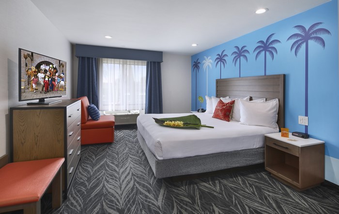 Bedroom with Disney characters on TV