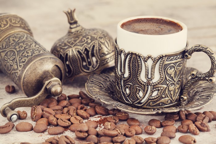 Turkish coffee cup with grinder and beans