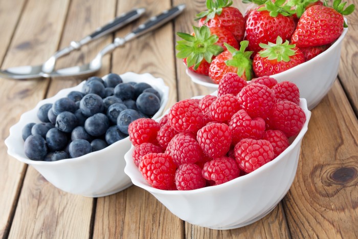 Raspberries, Blueberries, and Strawberries in Bowls