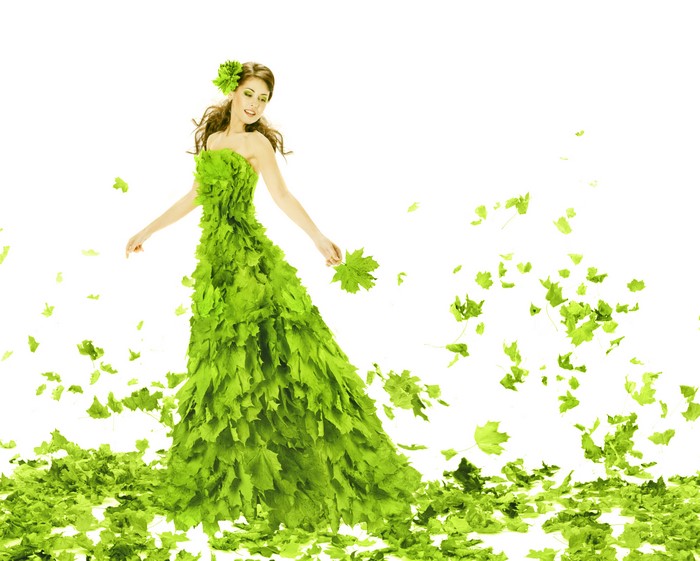Woman in a green leaf dress with falling leaves