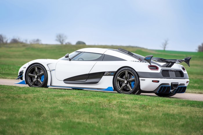 White Koenigsegg Agera RS1 parked on a grassy field