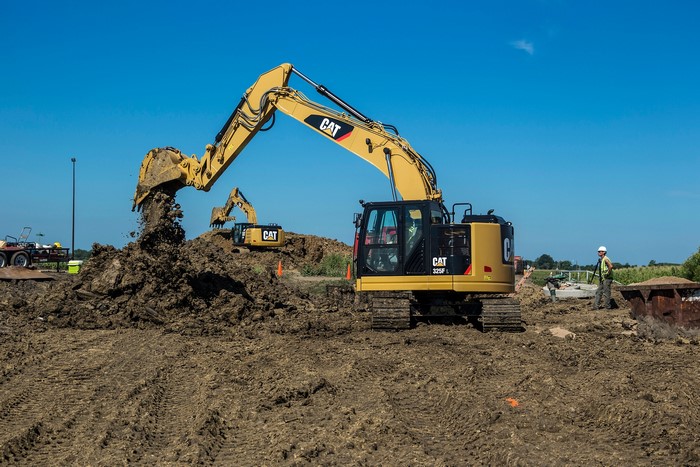 Caterpillar 325F L Excavator moving soil at construction site