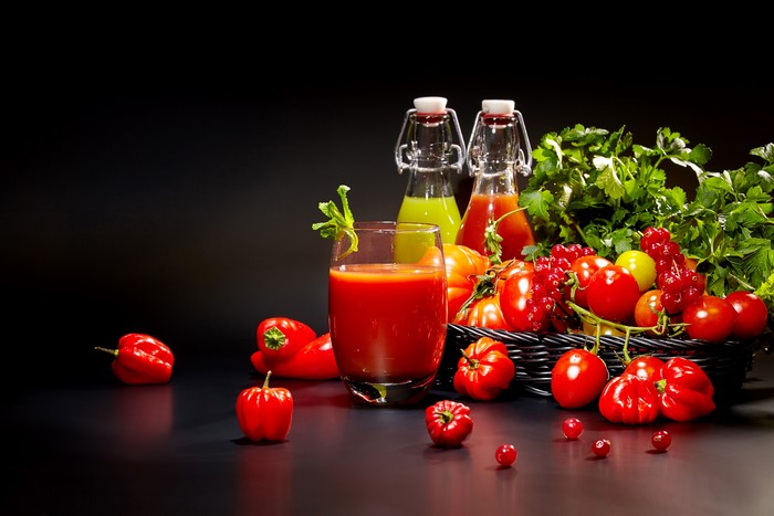 Tomatoes, Bell Peppers, Currants, and Juices in Bottles
