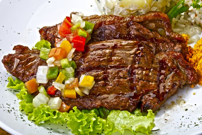 Grilled steak with salsa and rice