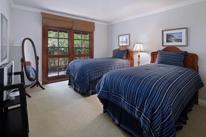 Bedroom with two beds and French doors