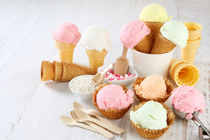 Ice cream cones and scoops with toppings