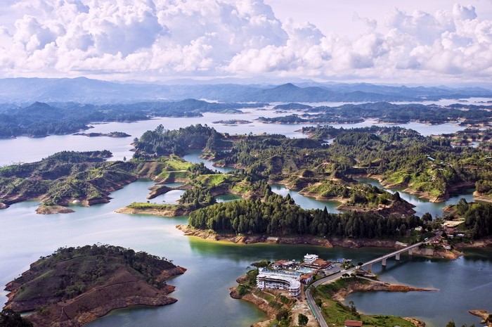 Aerial view of a lake with many islands and a bridge