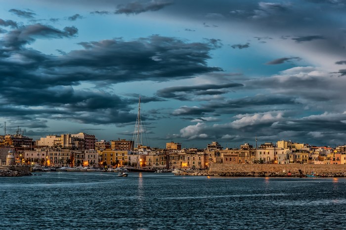 Trani, Puglia, Italy harbor at dusk with dramatic clouds