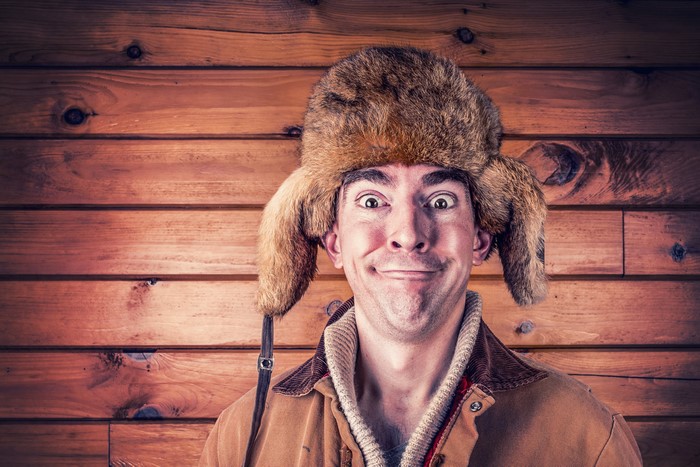 Man in a furry winter hat and jacket