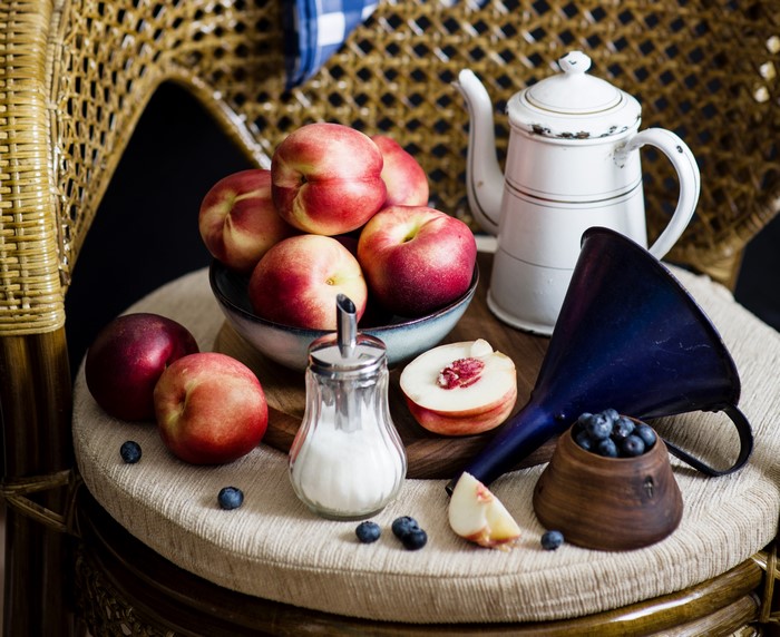 Still-life with kettle, peaches, and blueberries