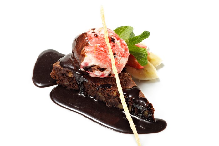 Chocolate brownie with ice cream and fruit