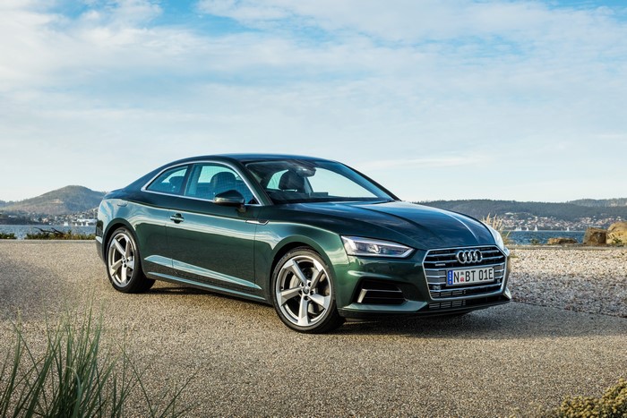 Green Audi A5 Coupe on a gravel road
