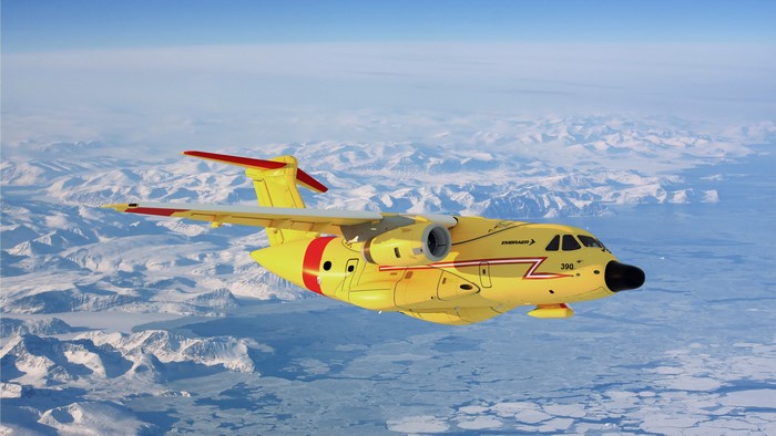 Embraer KC-390 airplane flying over icy mountains