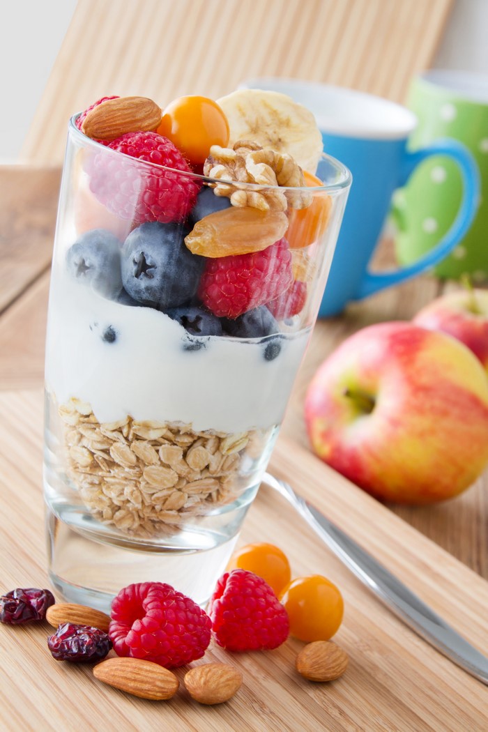 Fruit and yogurt parfait with nuts and berries