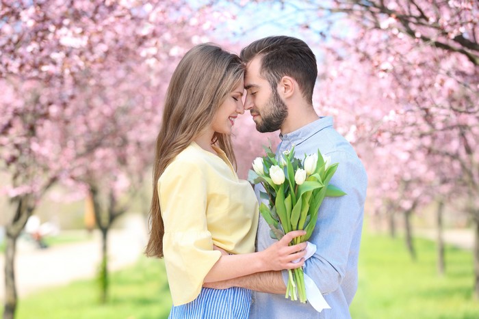 Couple in love with tulips in park