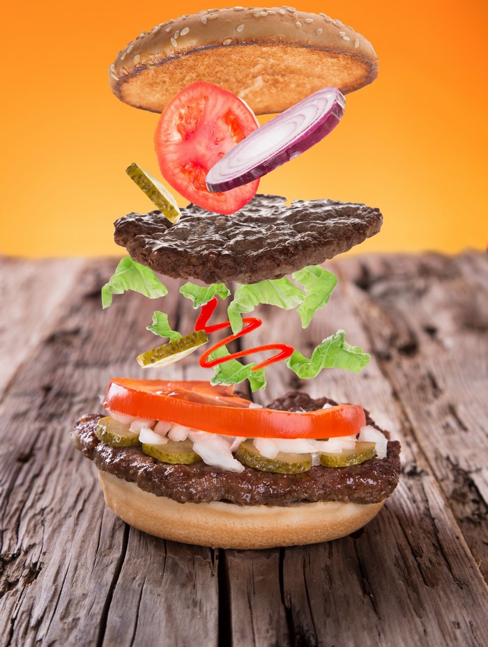 Deconstructed hamburger with flying ingredients