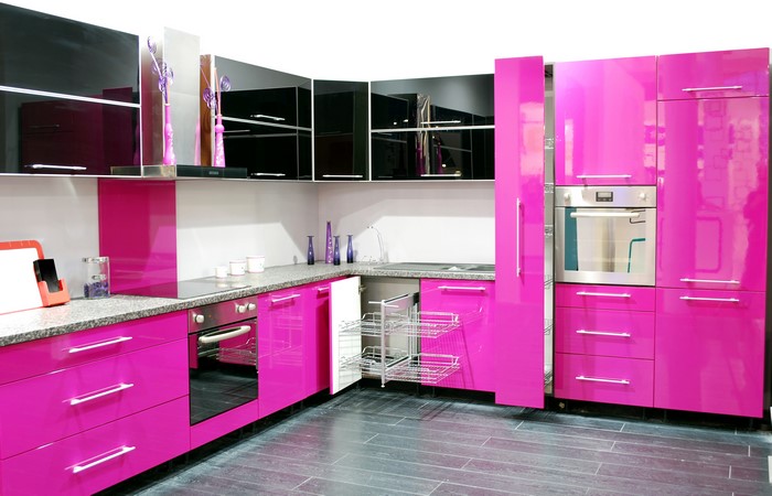 Modern kitchen with pink and black cabinets