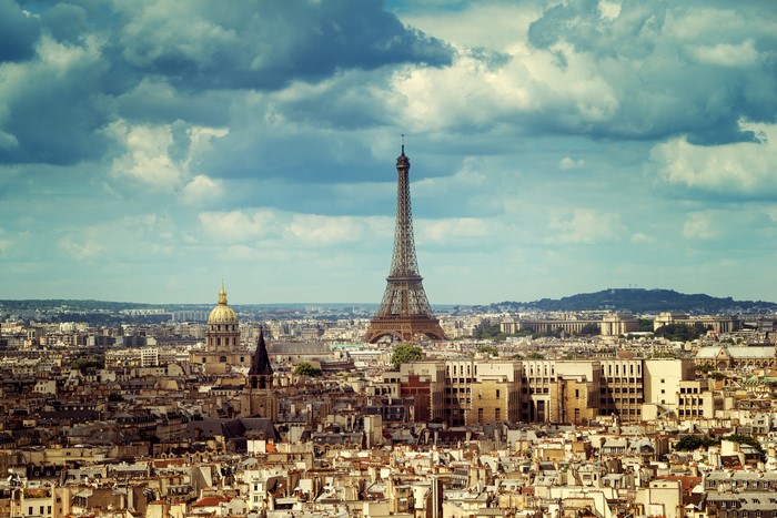 Paris cityscape with Eiffel Tower and clouds