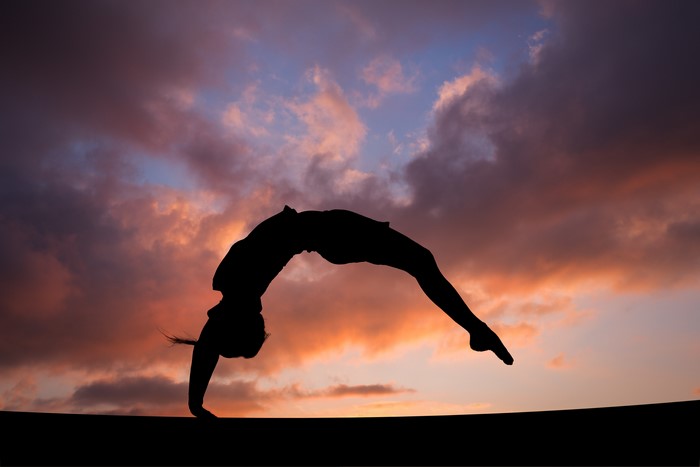 4K Silhouette of Gymnast in Evening Sky