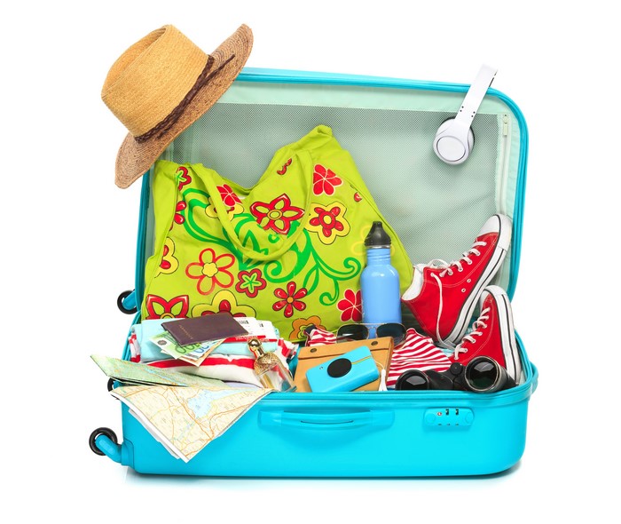 Suitcase packed with travel essentials