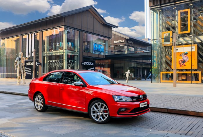 Red 2016 Sagitar GLI Volkswagen on a street