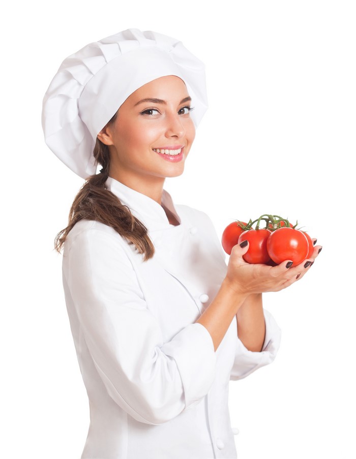 Chef holding tomatoes on white background
