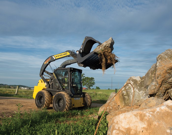 New Holland L234 Skid Steer Loader moving rocks