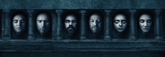 Game of Thrones heads displayed on a stone wall