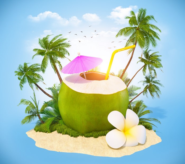 Coconut drink on a tropical island with palm trees