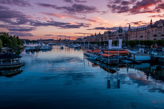 Stockholm marina at sunset with boats and buildings