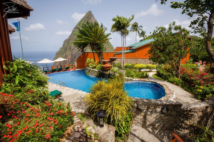 Resort pool with Pitons mountain view in Saint Lucia