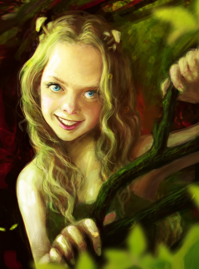 A young girl with blue eyes and blonde hair smiles.