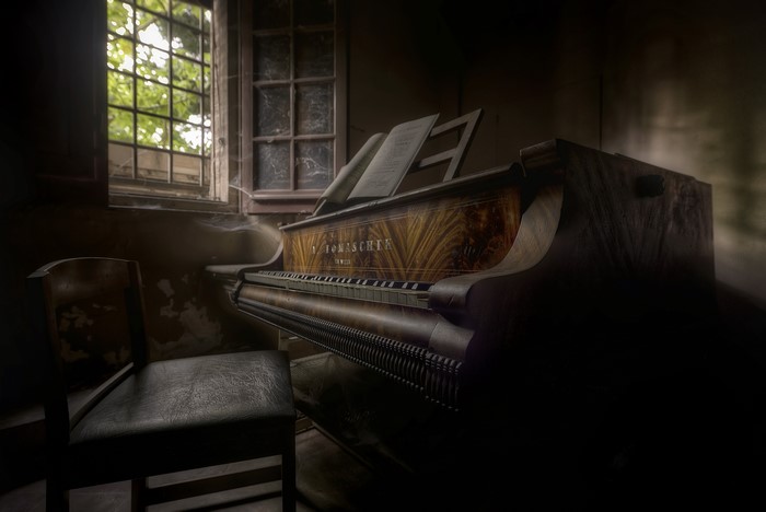 Retro piano in an abandoned room
