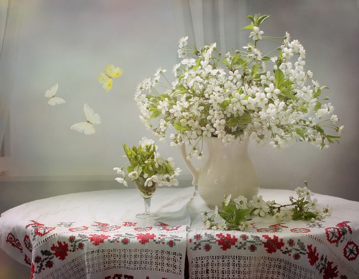 Still life with cherry blossoms and butterflies
