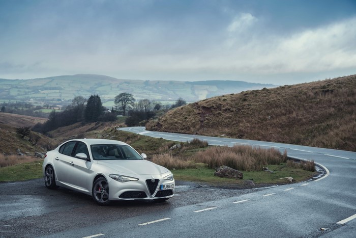 Silver Alfa Romeo Giulia Q2 on a winding road