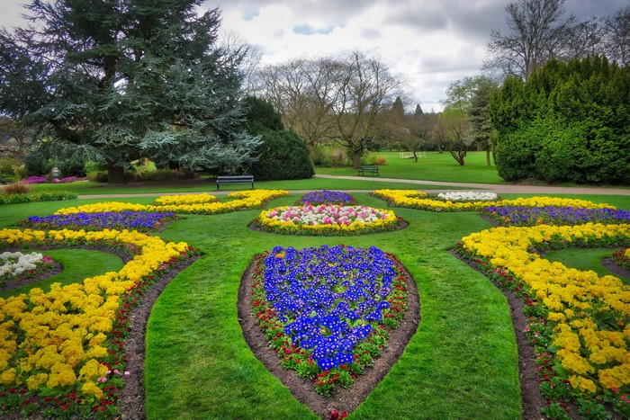 Sheffield Park Garden with flowerbeds and trees