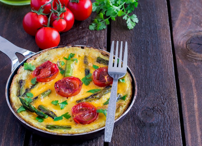 Frittata with Tomatoes and Asparagus on Wooden Planks