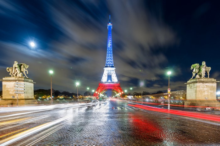 Eiffel Tower at Night in Paris with Light Trails